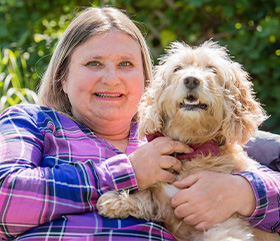 hearing dog recipient Mary with her hearing dog Harley