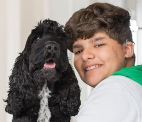 Rayane and his hearing dog Diesel