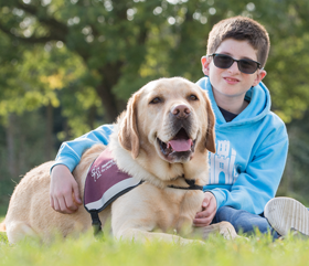 hearing dog Zach helping eleven-year-old Zach