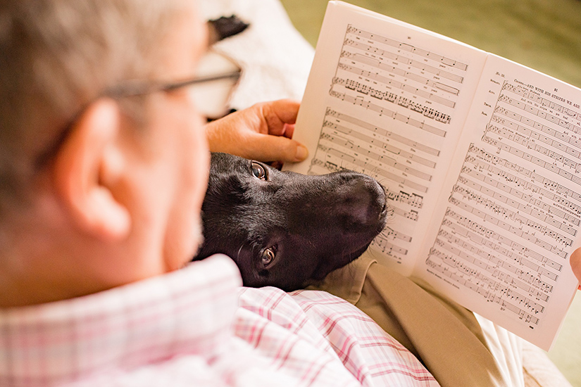 Chris and his hearing dog Rom sitting together