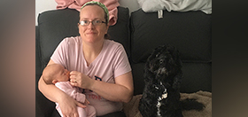 Kirsten with baby Noelle and cockapoo hearing dog Pickle