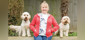 Janice with cockapoo hearing dogs Humphrey and Marti