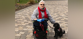 Carole and her hearing dog - miniature poodle Jack