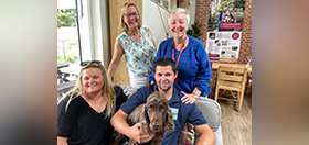 Emily, her husband Matthew, hearing dog volunteer trainers Linda and Jackie are all with hearing dog Marcus.