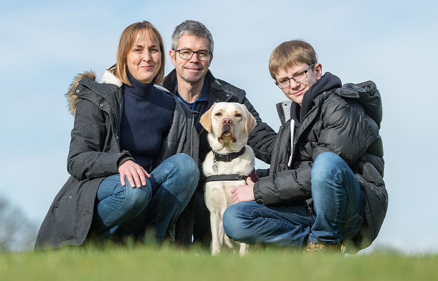 Oscar Williamson with mum Hilary, dad Paul and hearing dog Rosie