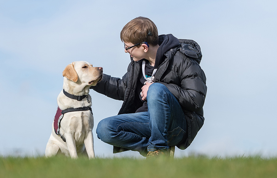 Oscar Williamson and hearing dog Rosie