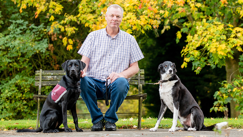 Steve Beal with hearing dog Jemma and retired hearing dog Yogi