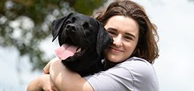 Ana and her hearing dog Valley