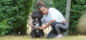 Alexis and her hearing dog - cockapoo Rudy